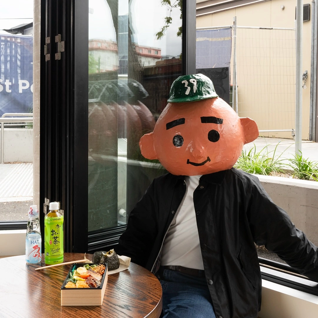 The Domo39 onigiri café character, a distinctive brand mascot that helps customers instantly connect the image with the business.